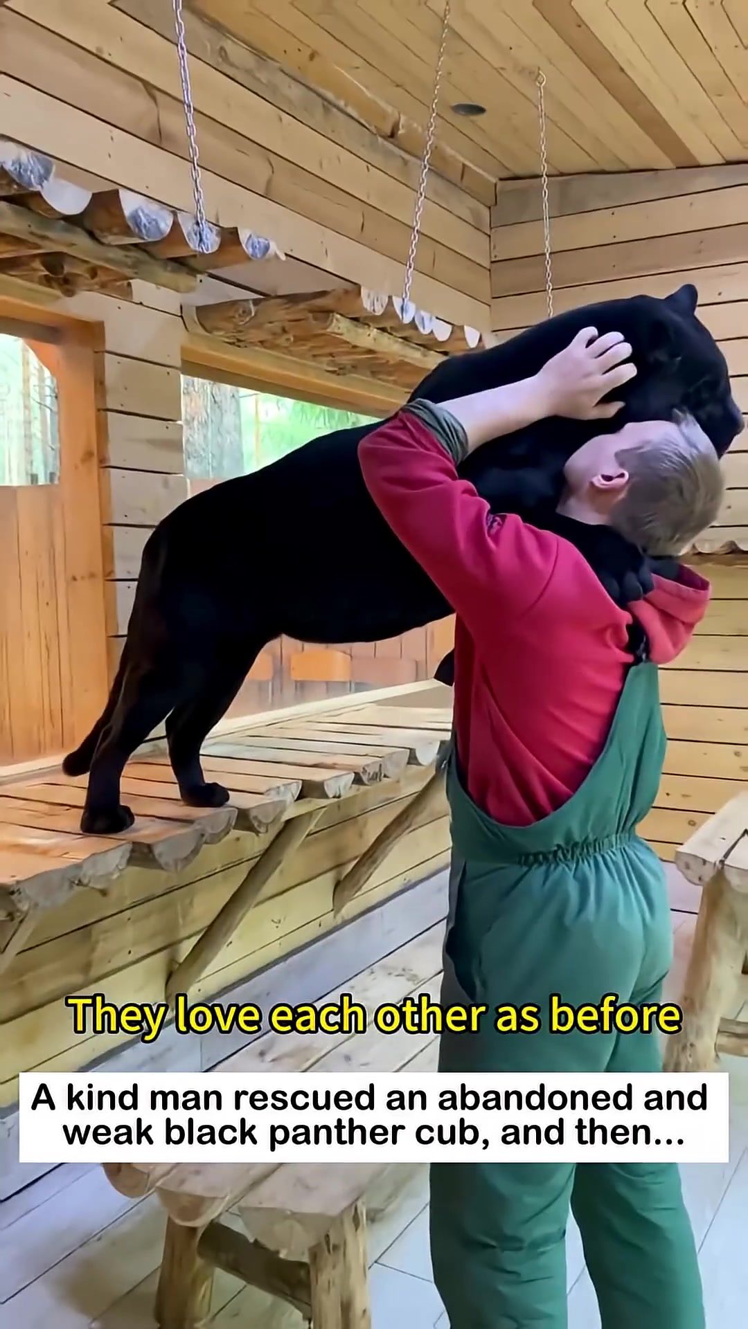 A man hugging a large black panther, both appearing deeply affectionate.