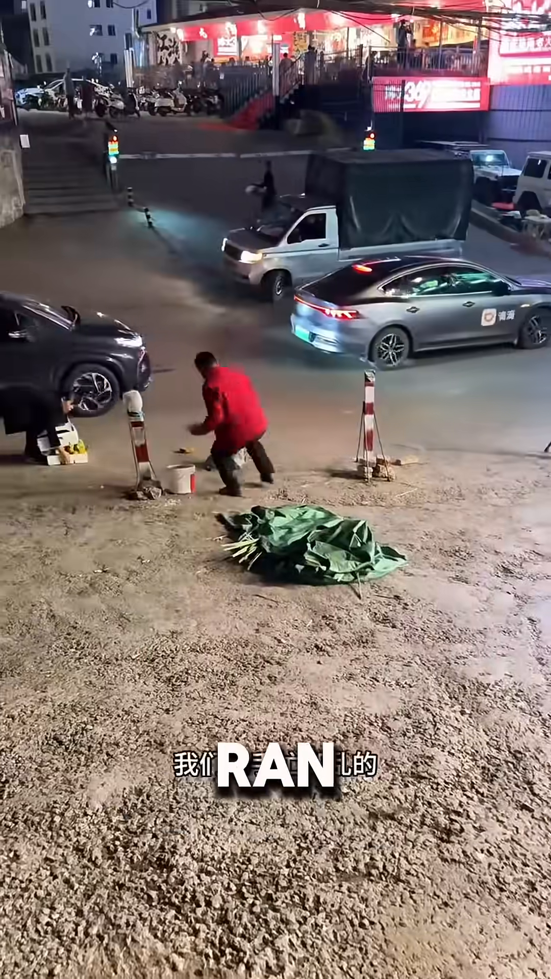 The street vendor quickly gathers his belongings as police arrive, while the woman stands nearby.