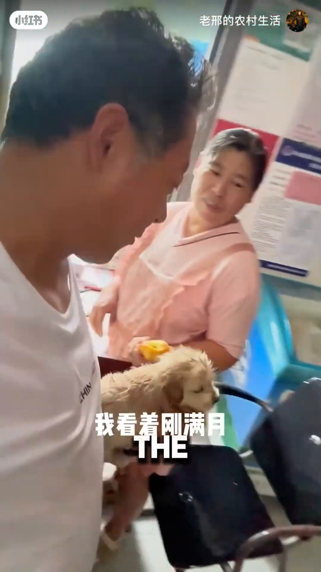 A store owner is handing a white plastic bag to a man who is holding a puppy.