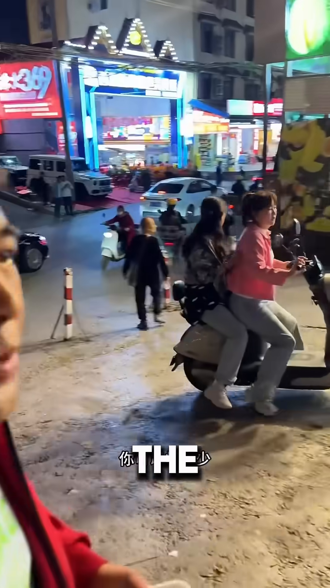 The woman holds the puppy's cage, ready to take it home after the transaction.