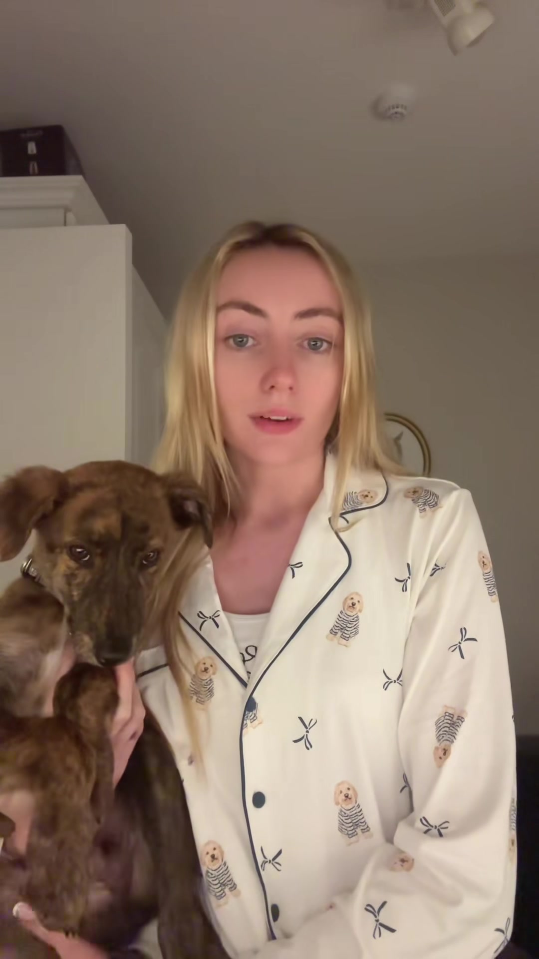 Chloe holds the brindle puppy upright during an early update.